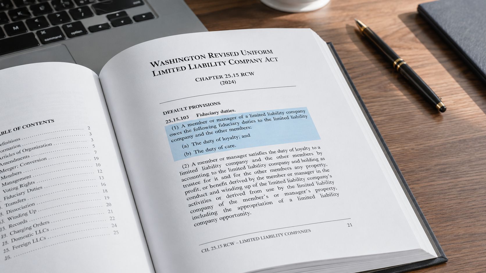 A copy of the Washington Revised Uniform Limited Liability Company Act book open on a wooden desk.